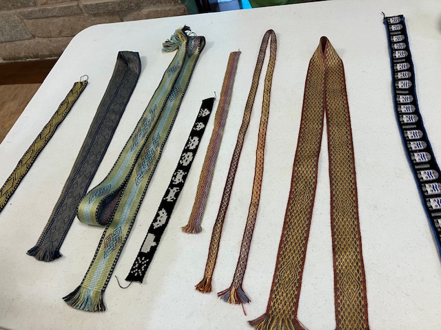 Several handwoven bands on a table