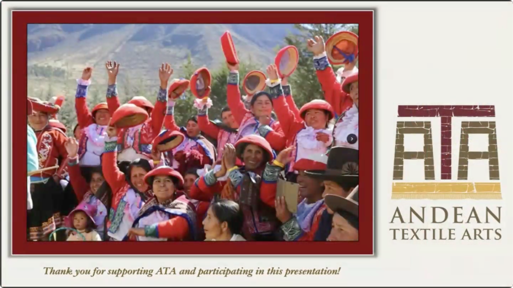 A group of people dressed in traditional Peruvian garments wave.