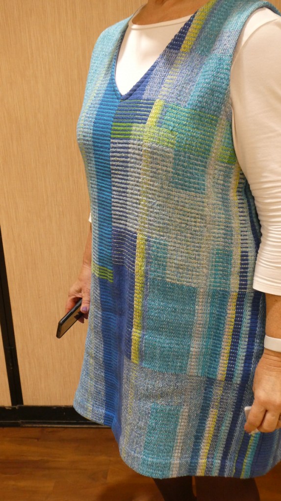 Kathy A., jumper. Left side view of a woman wearing a blue and yellow striped jumper.