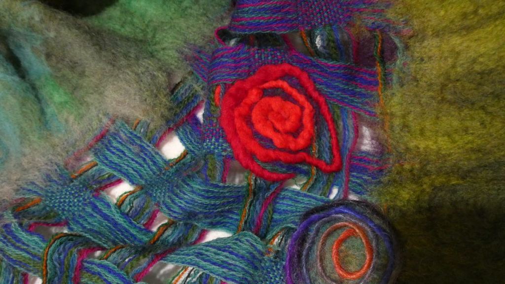 Tammy D., closeup of red and multi-color spiral accents.