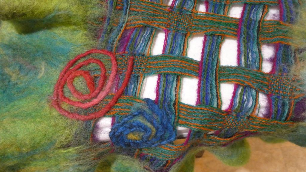 Tammy D., closeup of red and blue spiral accents.