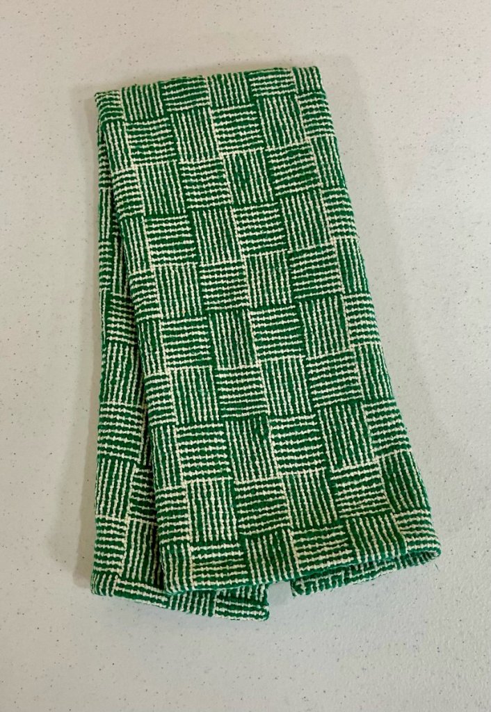 Patterned green and white towel