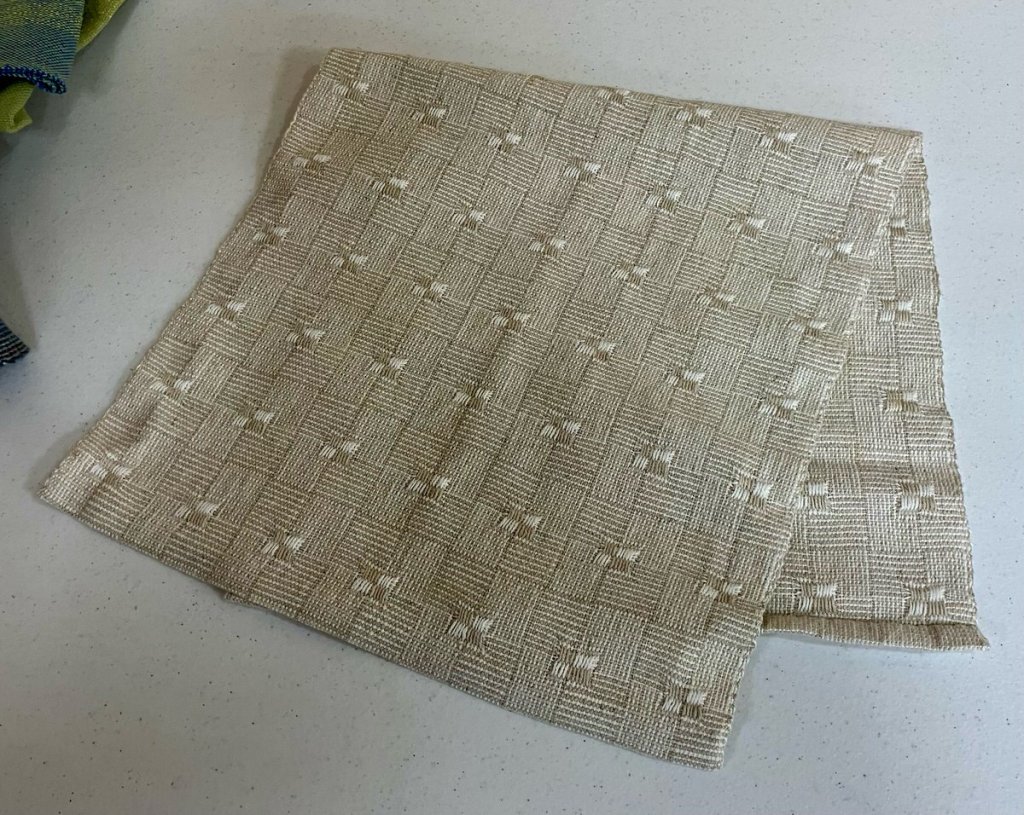 Tan and cream patterned table runner