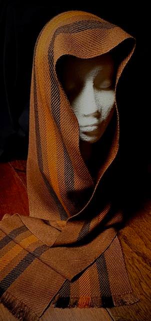 Scarf in various shades of brown and black stripes that go from end to end.