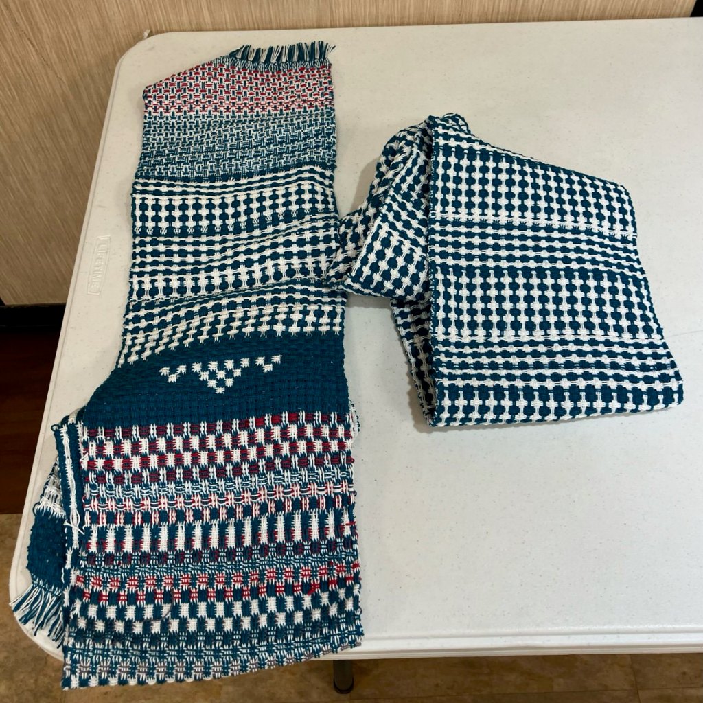 A blue, red, and white double huck scarf.