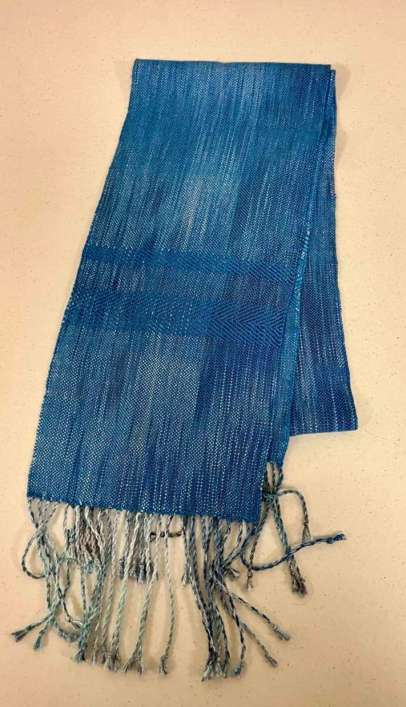 Tam M. - Blue scarf, using both twill and plain weave, with twisted fringe.
